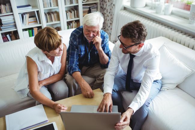 Retirees Consulting with a Financial Advisor