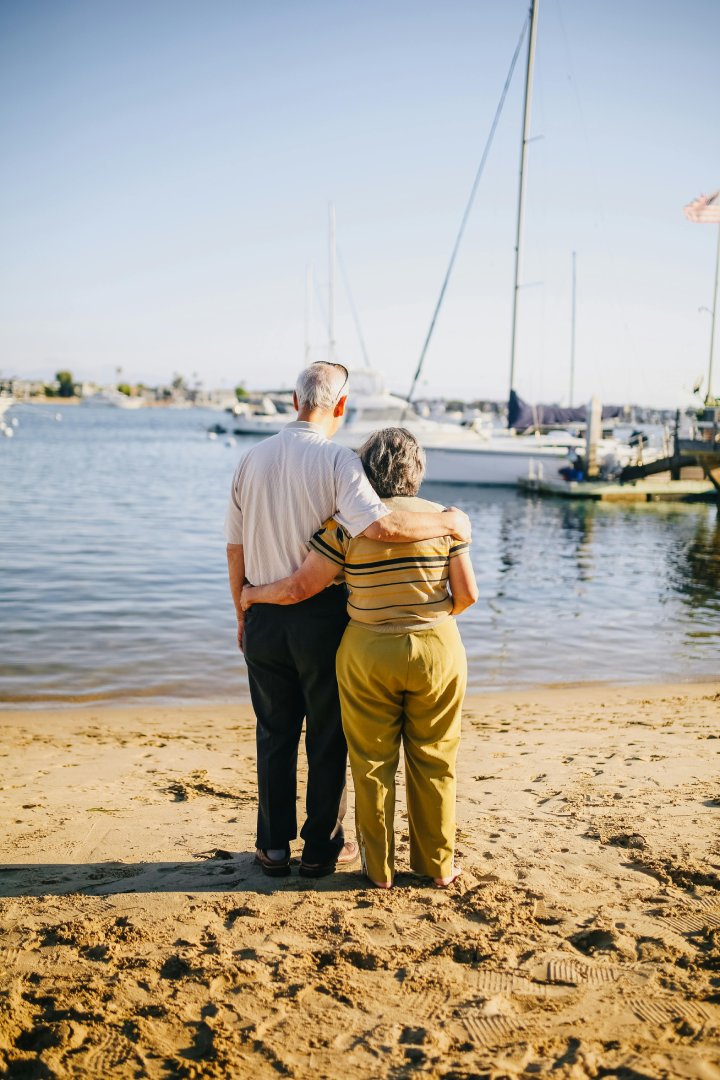Senior couple standing on the beach