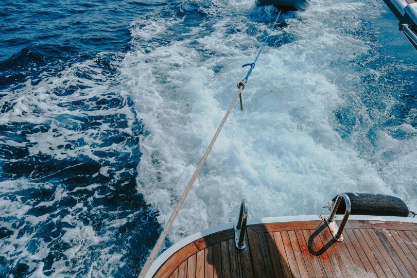 A boat gently floats on calm water